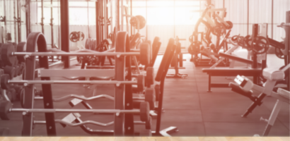 Person working out at the gym while choosing the best time for a consistent fitness routine.